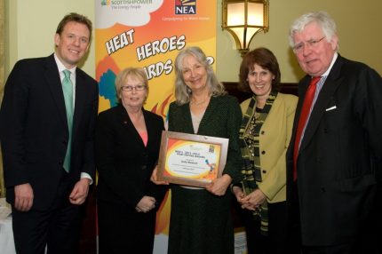 Judy Stewart receiving her award from MP Linda Riordan and members of NEA and Scottish Power