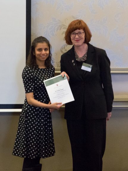 Dr Kamal - left - recieves her award from Laura Stroud, Director of Education at the School of Medicine