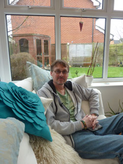 man in conservatory sat on the sofa South West Yorkshire Partnership NHS Foundation Trust