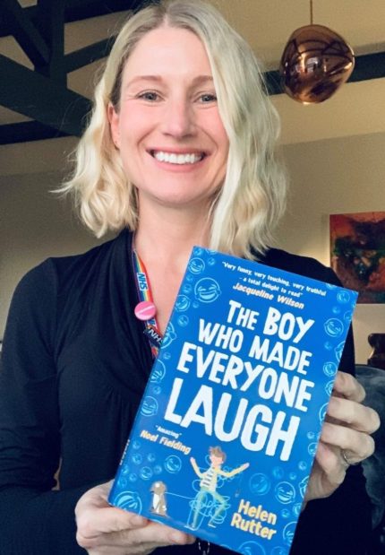 Image of person holding the boy who made everyone laugh book