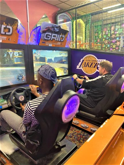 Two men on arcade games