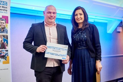 Richard Watterston on stage toreceive his highly commended award with Salma Yasmeen, director of innovation