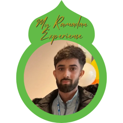 Adil Asghar standing in front of balloons