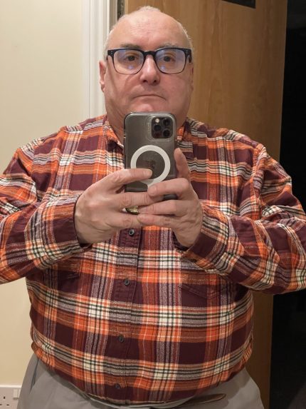 A photo of a man taking a selfie