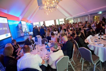 Photo of a room full of people at an award ceremony