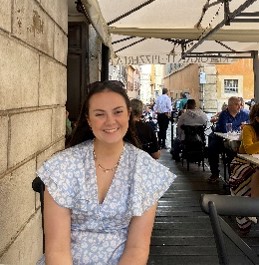 A photo of a woman smiling to camera