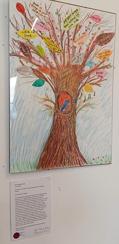 Photo of a tree drawn in oil pastels at an art exhibition