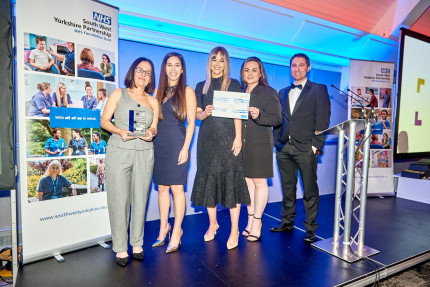 Photo of a group of people at an award ceremony