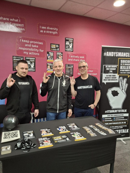 Photo of 3 men making 'ok' symbol with hands
