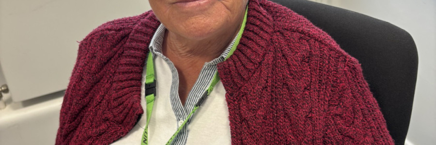 Photo of woman wearing red cardigan
