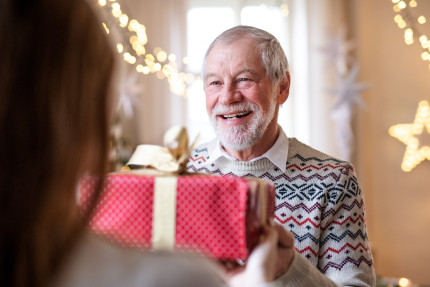 Image of someone receiving a Christmas gift.