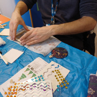 Person holding a craft frame