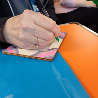 Person colouring a frame
