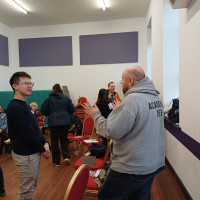 Recovery College Hong Kong delegation visit - two people talking