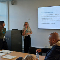 Presenters talking to audience