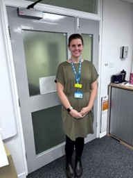 Colleague standing in front of a door