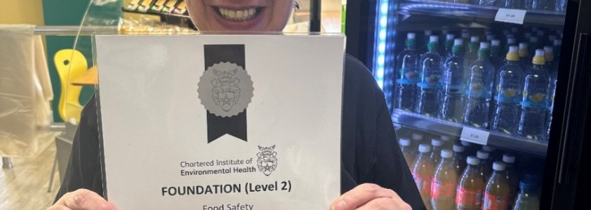 Photo of volunteer Jo-Anne holding a certificate