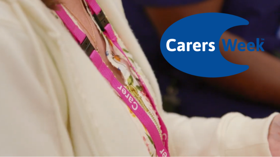 An image of a pink lanyard which reads 'Carer'