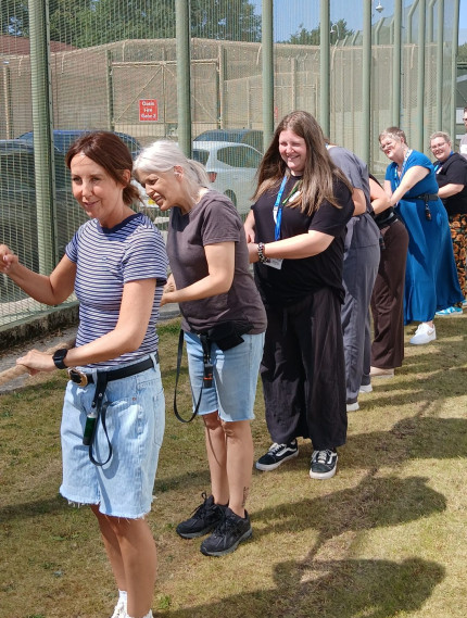 People playing a game of tug of war