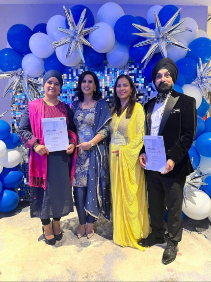 Dr Mohinder Kapoor standing with a certificate and colleagues at the NHS APNA Awards 2026